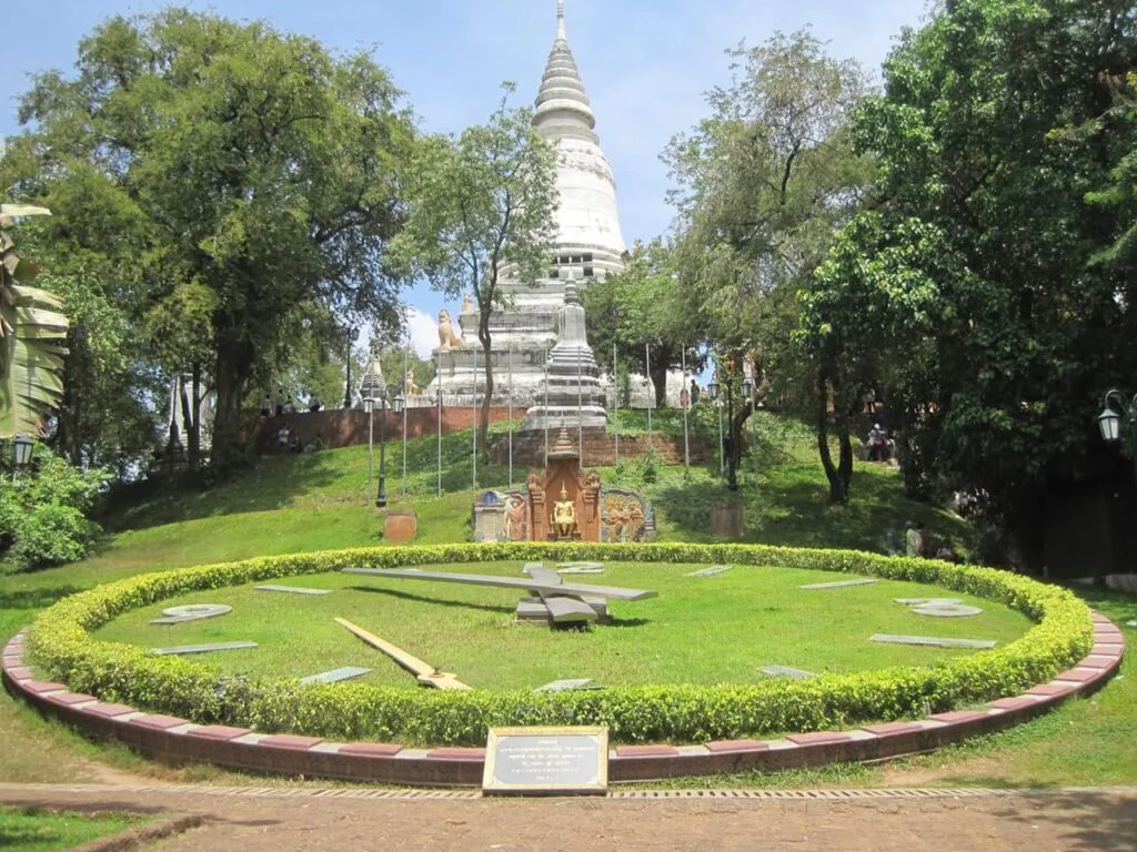 Wat Phnom temple perched atop a tree-covered hill, a historic and spiritual landmark in Phnom Penh, Cambodia-01.