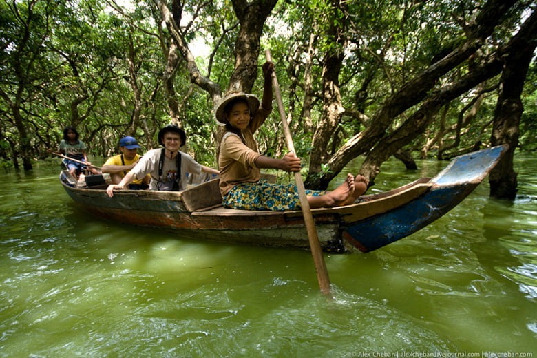Boat riding on the seasonal flooded forest at Kampong Phluk, Tonle Sap Lake, Siem Reap, Cambodia